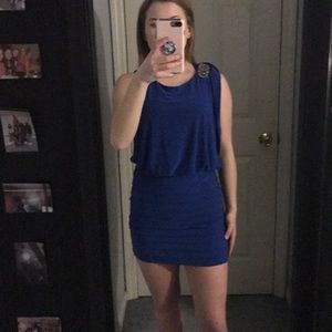 Blue dress with slightly open back. Worn lightly
